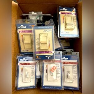 Lot of 36 Leviton Light Switches and Outlets. See Listing For Details.